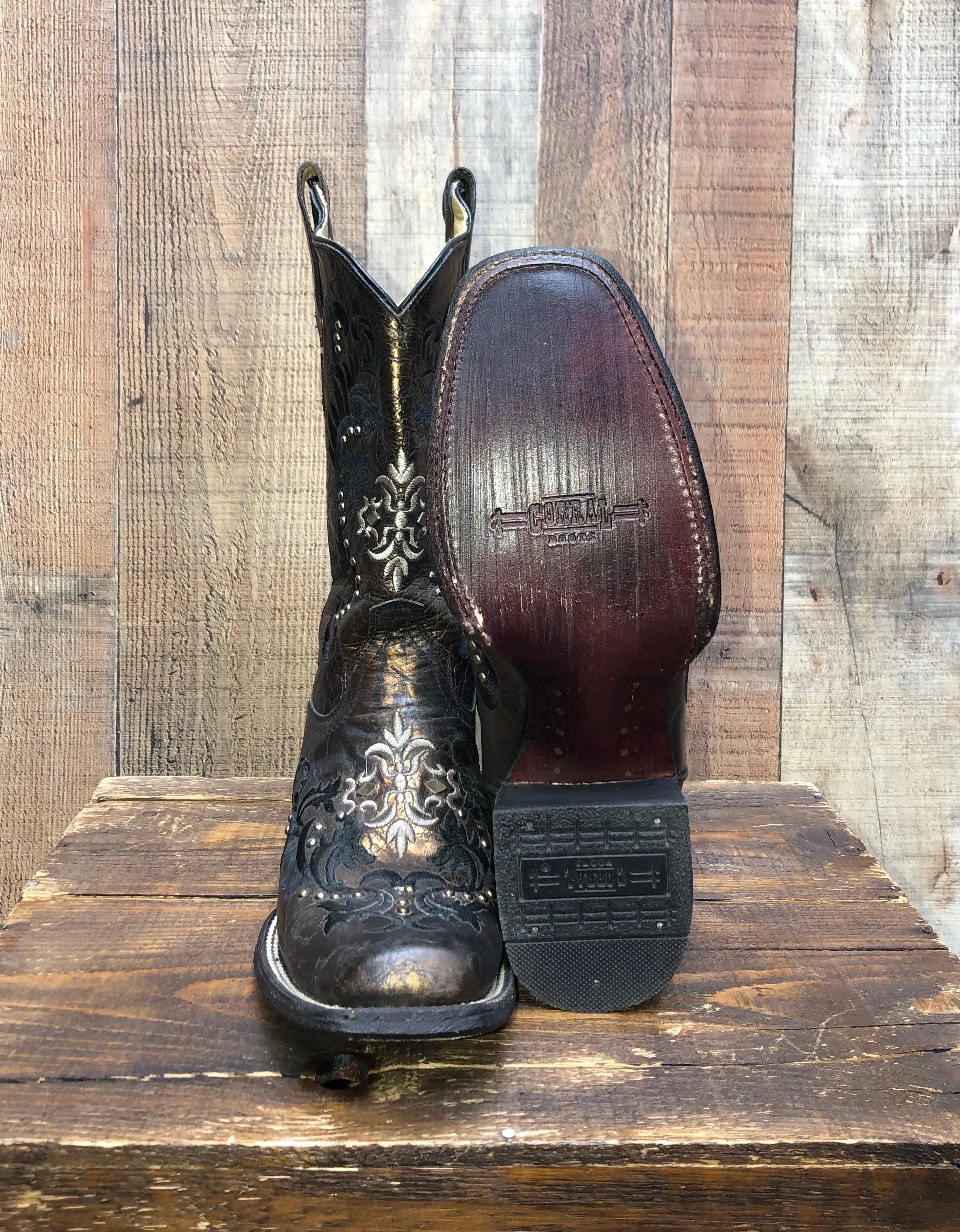 Corral Stud-Embellished Western Boots in Black and Bronze.