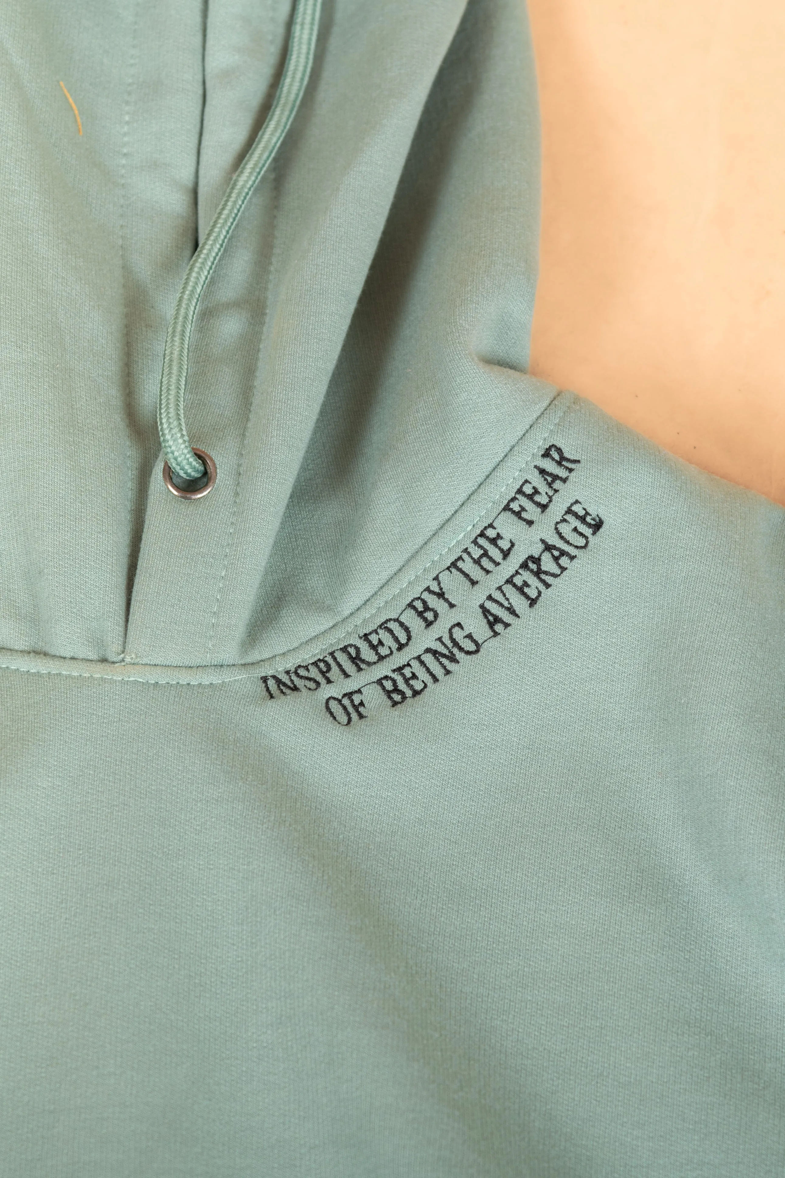 Inspired by the fear of being average embroidered Hoodie