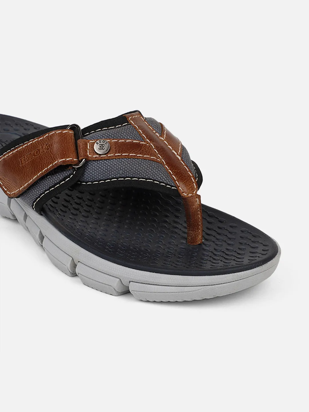 Men's brown leather flip flops.