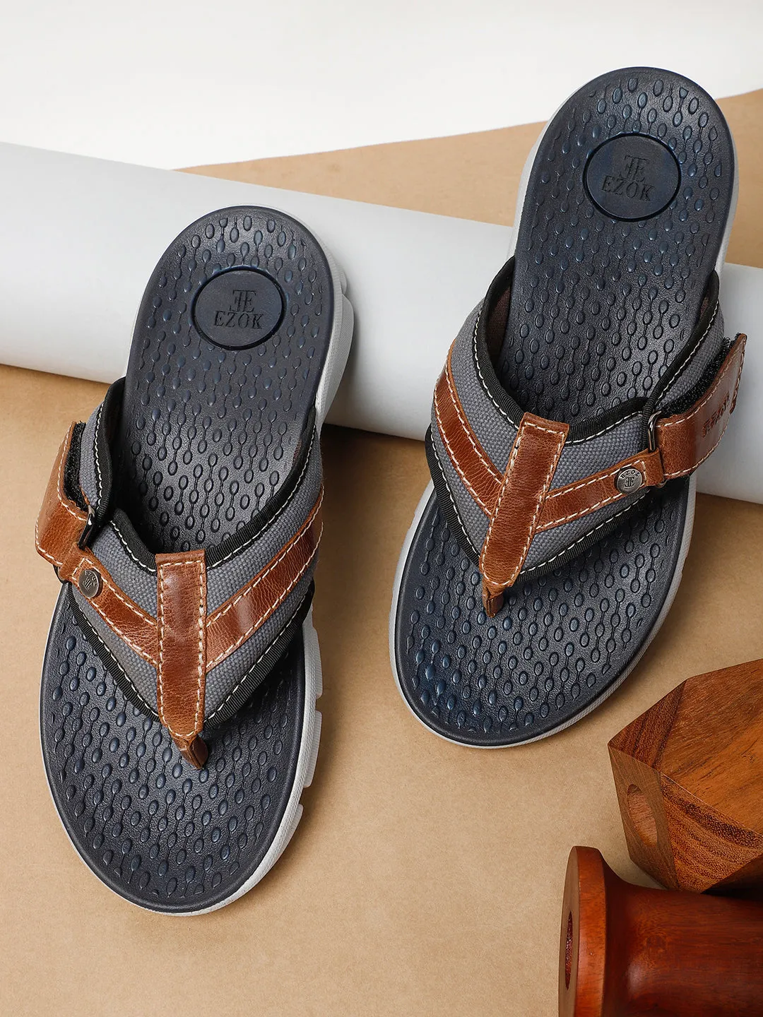 Men's brown leather flip flops.