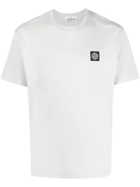 Stone Island white cotton compass motif t-shirt.